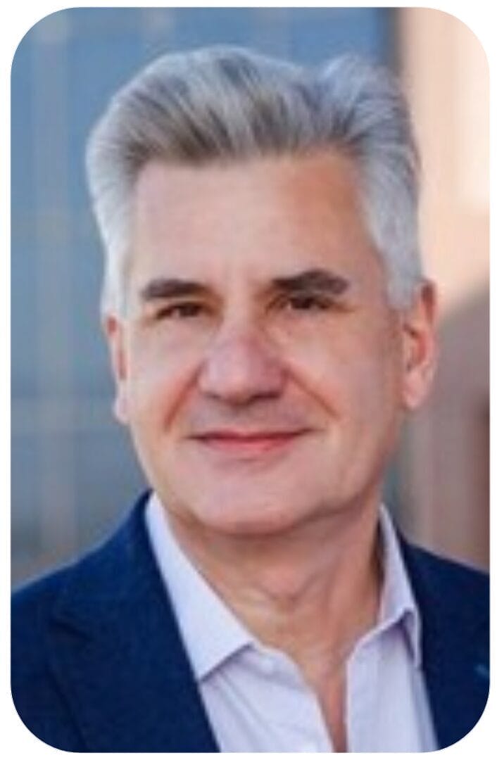 Headshot of middle-aged man with gray hair