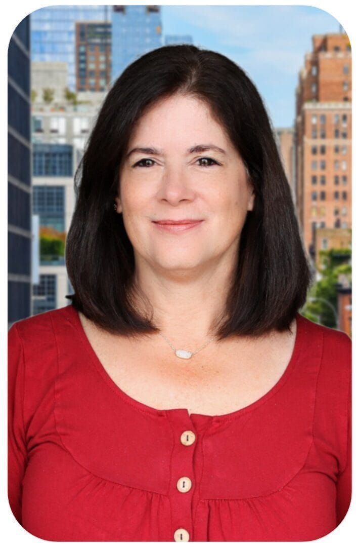Woman in red blouse with city backdrop