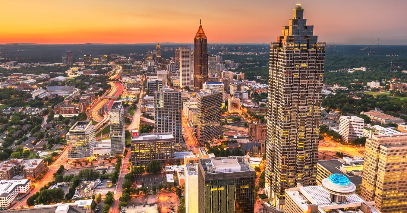 Downtown skyline at sunset with glowing highways