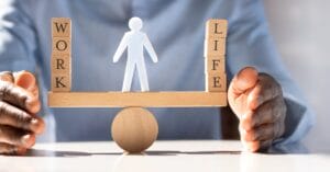 Work-life balance concept with wooden blocks and figure